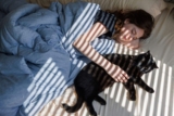 The real reason your cat loves to sleep by your side